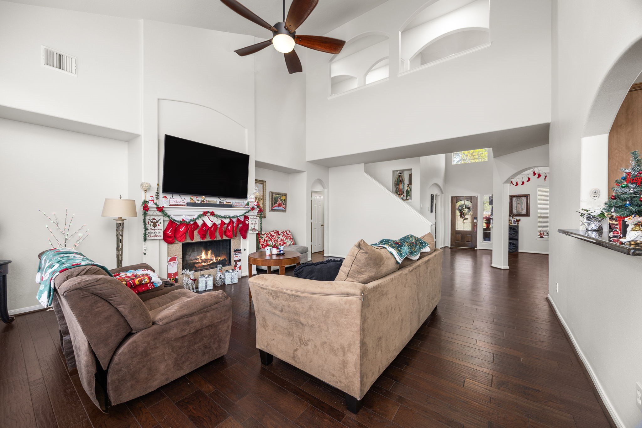 927 Spring Source Place Spring, TX 77373 - Photo 10 of 37 a living room with furniture and a flat screen tv