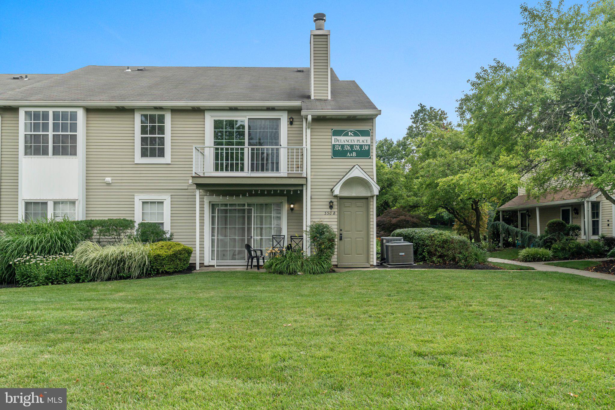 330 B Delancey Place Mount Laurel, NJ 08054 - Photo 1 of 21 a front view of a house with garden