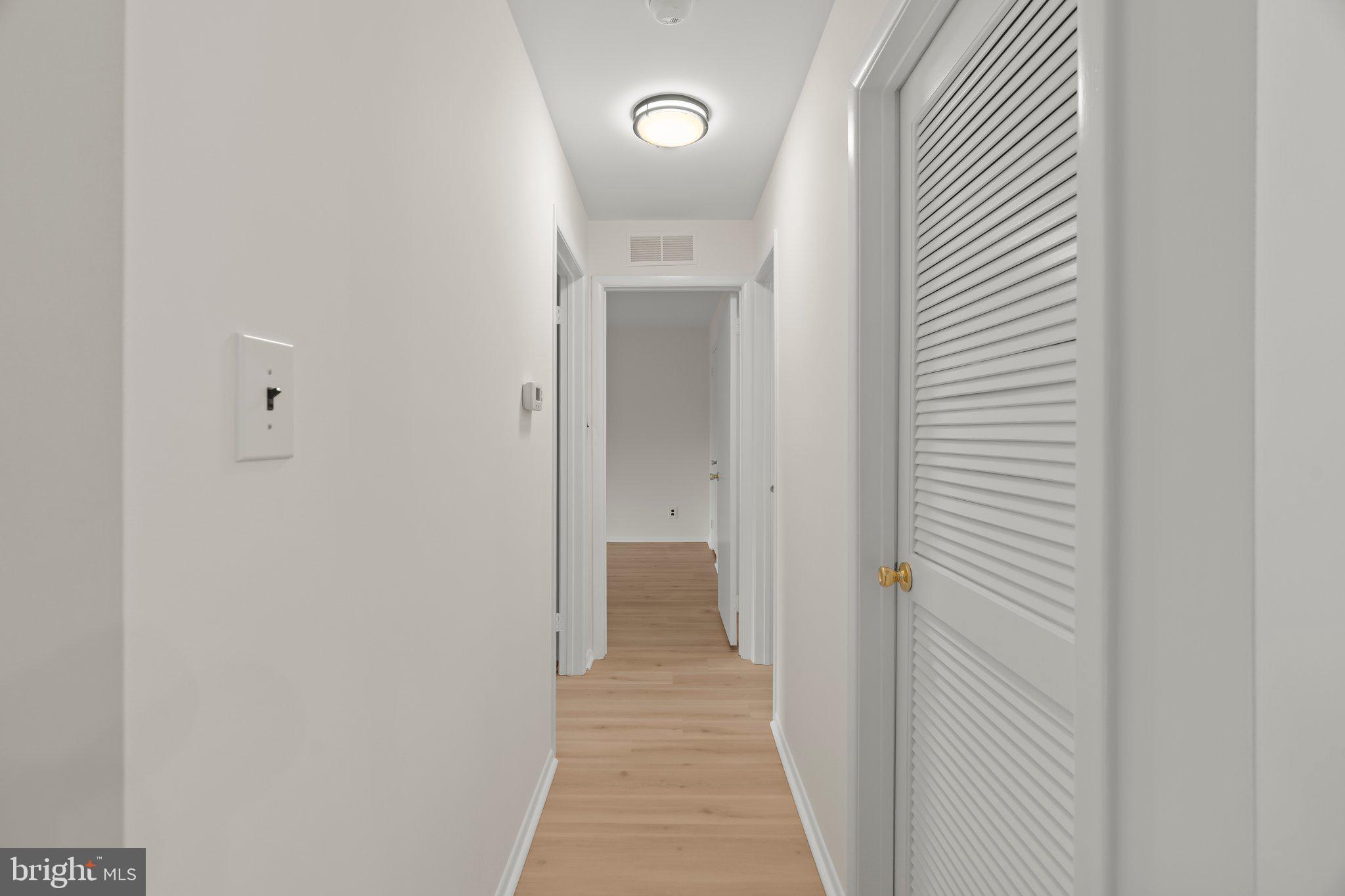 330 B Delancey Place Mount Laurel, NJ 08054 - Photo 12 of 21 a view of a hallway with wooden floor