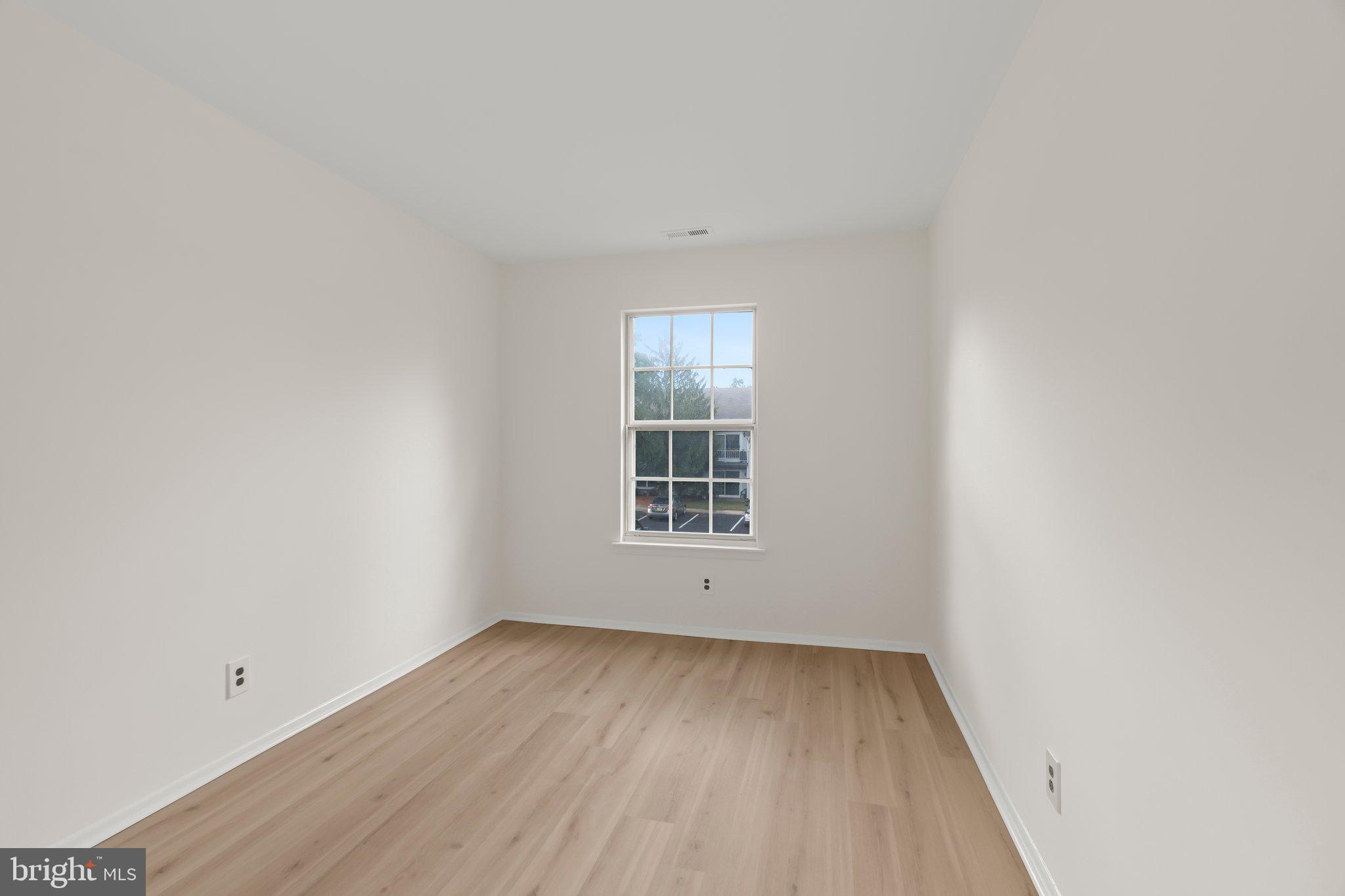 330 B Delancey Place Mount Laurel, NJ 08054 - Photo 14 of 21 a view of a room that has wooden floor and window