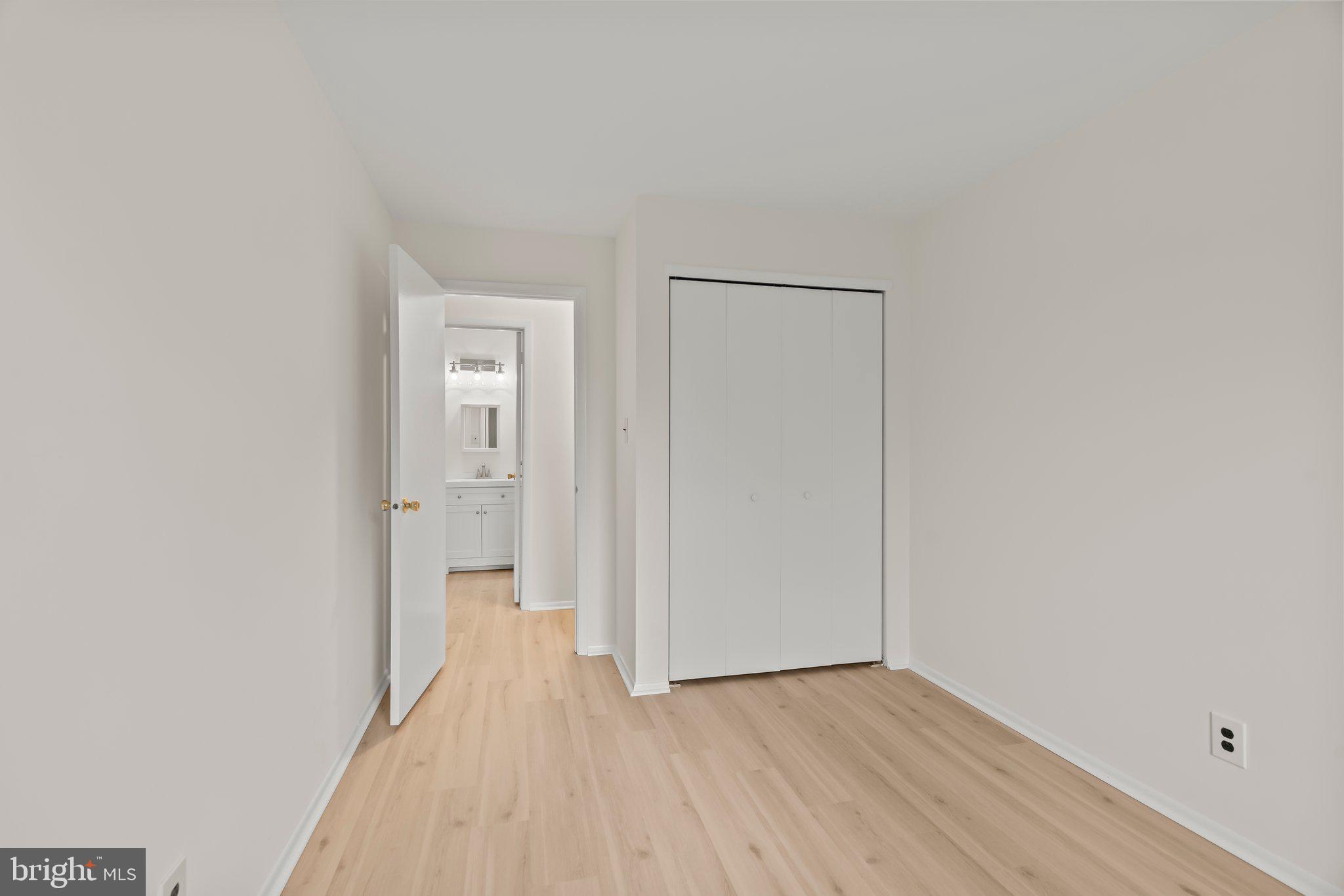 330 B Delancey Place Mount Laurel, NJ 08054 - Photo 15 of 21 a view of a room with wooden floor and a bathroom