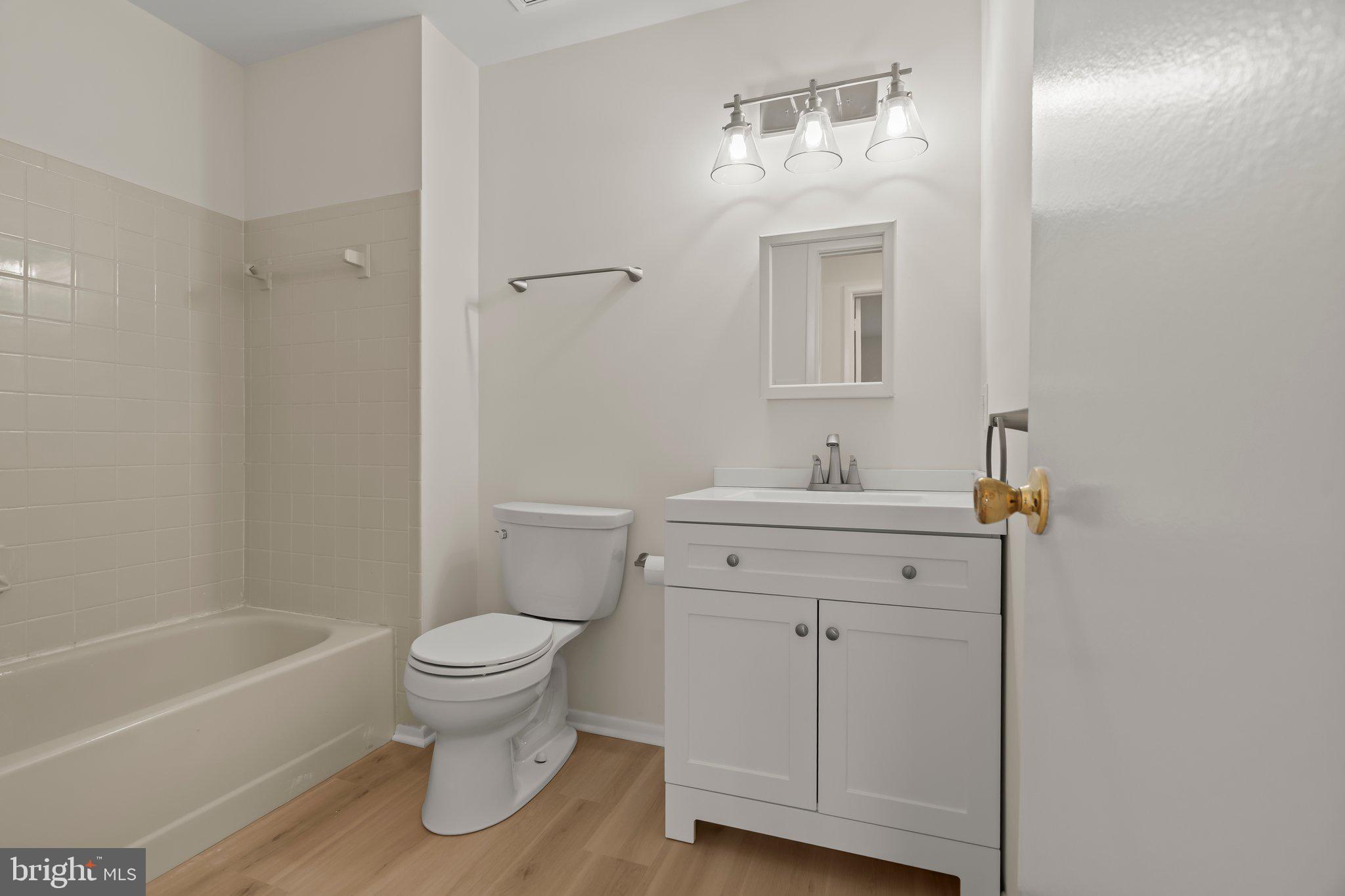 330 B Delancey Place Mount Laurel, NJ 08054 - Photo 19 of 21 a bathroom with a sink toilet vanity and tub