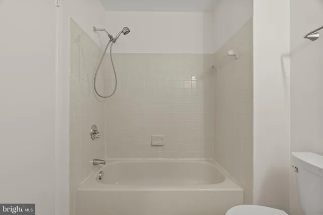 a bathroom with a bath tub and a shower