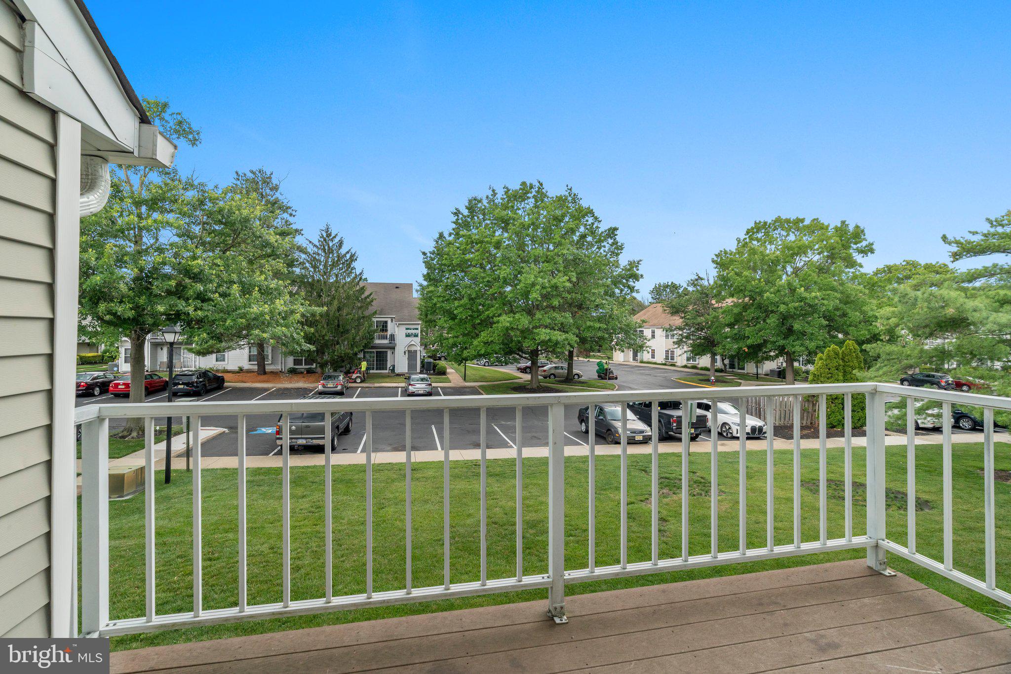 330 B Delancey Place Mount Laurel, NJ 08054 - Photo 21 of 21 a view of a deck with a big yard and large trees