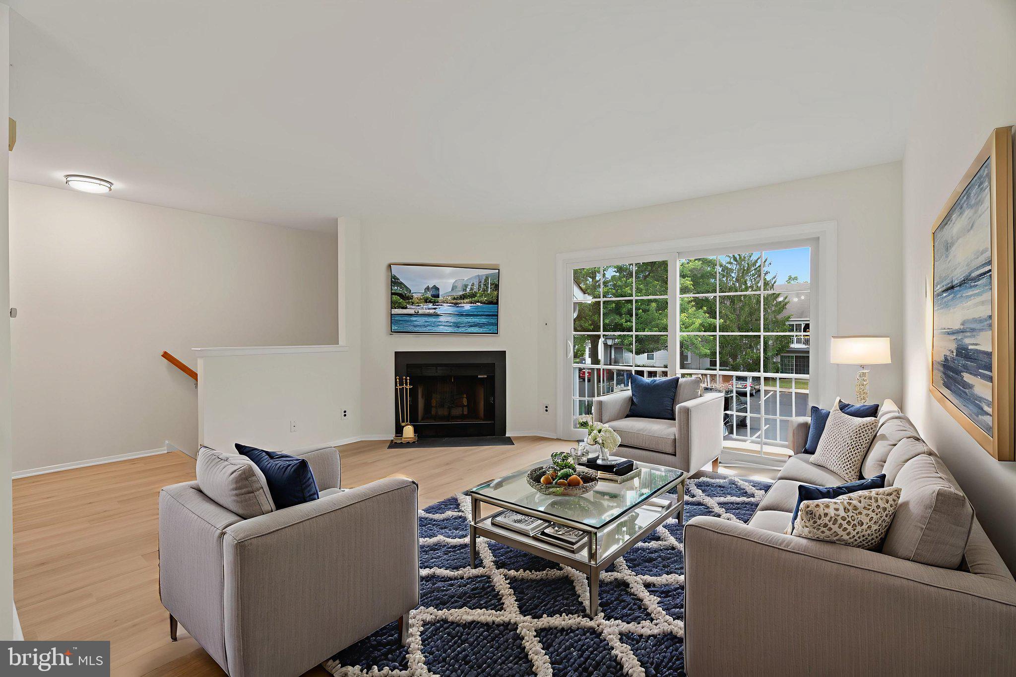 330 B Delancey Place Mount Laurel, NJ 08054 - Photo 5 of 21 a living room with furniture and a fireplace