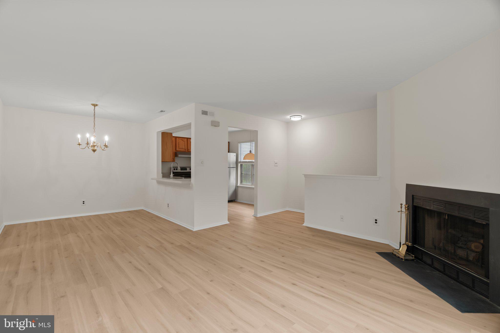 330 B Delancey Place Mount Laurel, NJ 08054 - Photo 7 of 21 an empty room with windows and fireplace