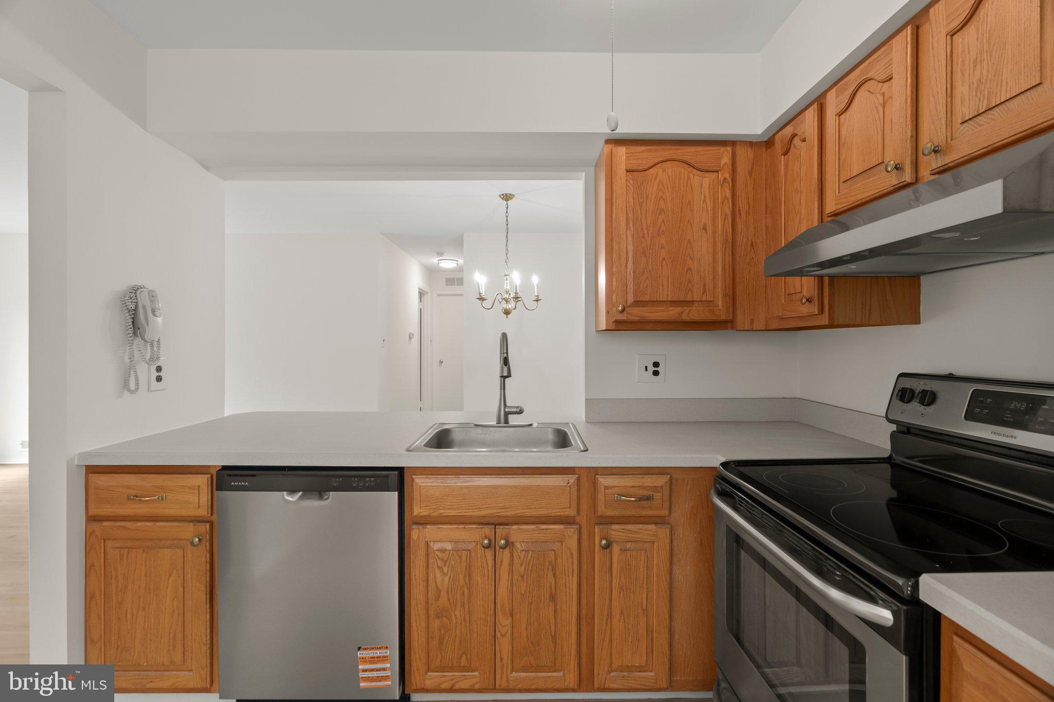 330 B Delancey Place Mount Laurel, NJ 08054 - Photo 10 of 21 a kitchen with stainless steel appliances granite countertop a sink stove and cabinets