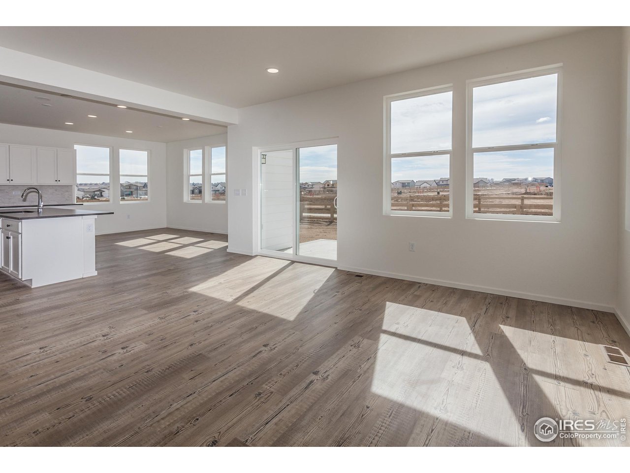 6642 4th St Road Greeley, CO 80634 - Photo 8 of 40 LIVING ROOM AND DINING ROOM