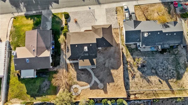 an aerial view of residential houses with outdoor space