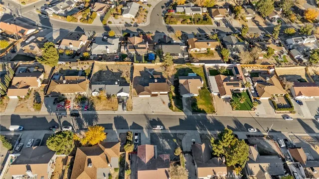 an aerial view of residential houses with outdoor space