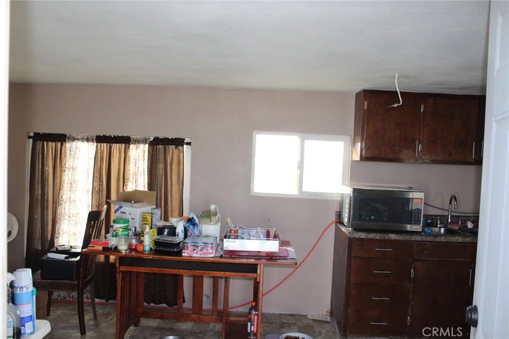 12543 Buckwheat Road Phelan, CA 92371 - Photo 11 of 37 a view of a workspace with a window