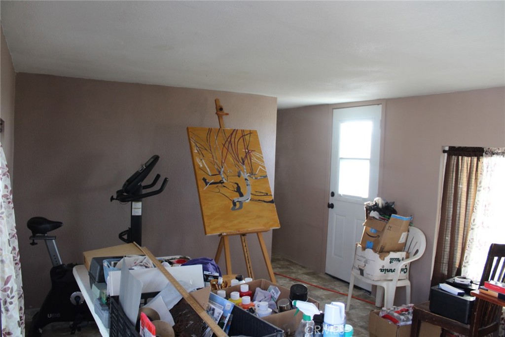 12543 Buckwheat Road Phelan, CA 92371 - Photo 12 of 37 a room with toys and a window