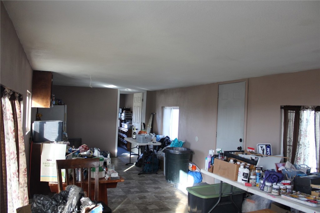 12543 Buckwheat Road Phelan, CA 92371 - Photo 13 of 37 a living room with furniture and a flat screen tv