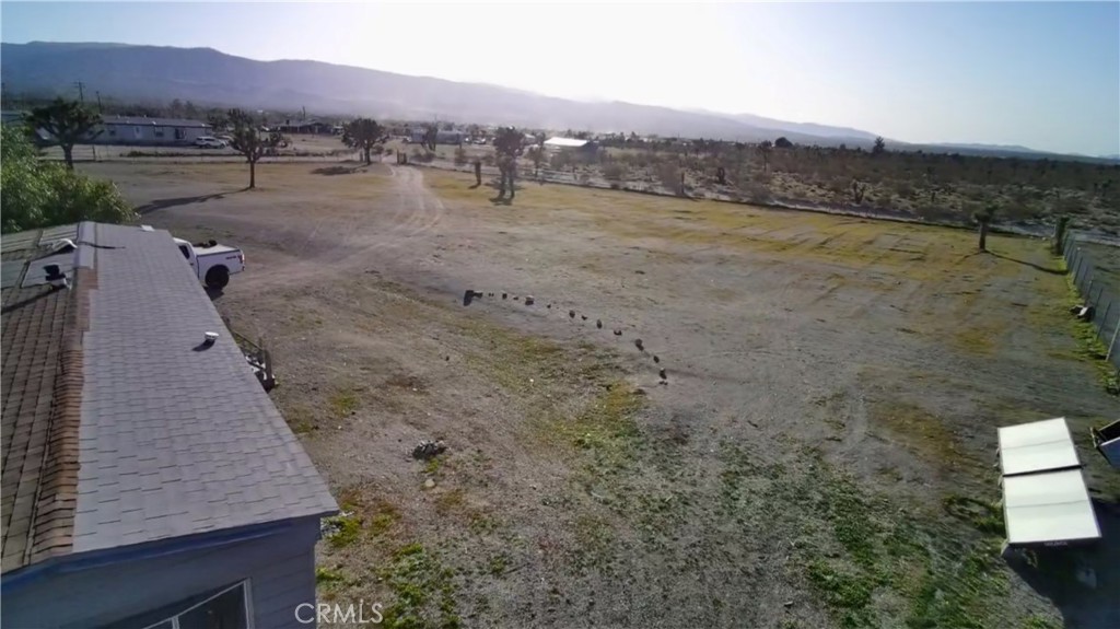 12543 Buckwheat Road Phelan, CA 92371 - Photo 31 of 37 a view of a dry yard with mountain