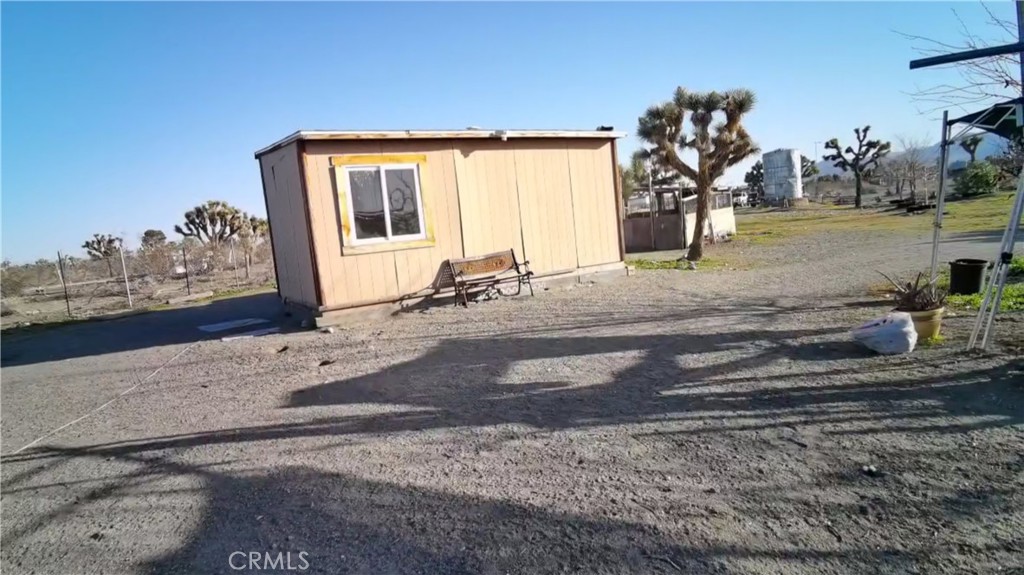 12543 Buckwheat Road Phelan, CA 92371 - Photo 36 of 37 a front view of a house with a yard