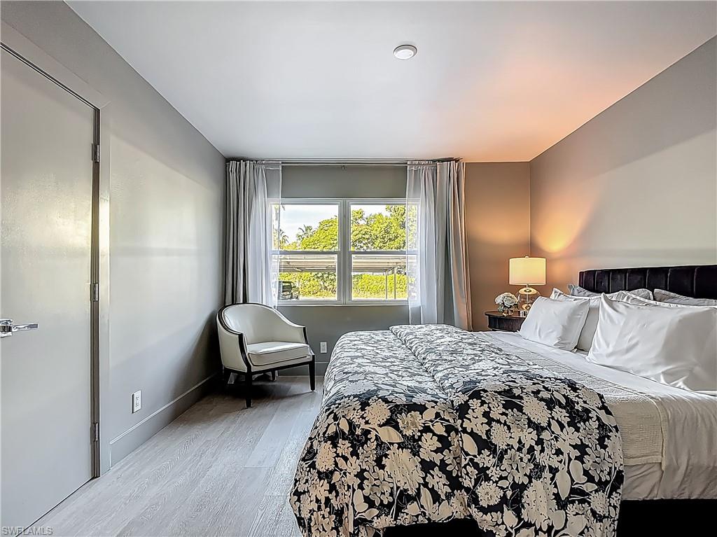 2544 First Street, Unit 102 Fort Myers, FL 33901 - Photo 19 of 26 a bedroom with a bed and a window