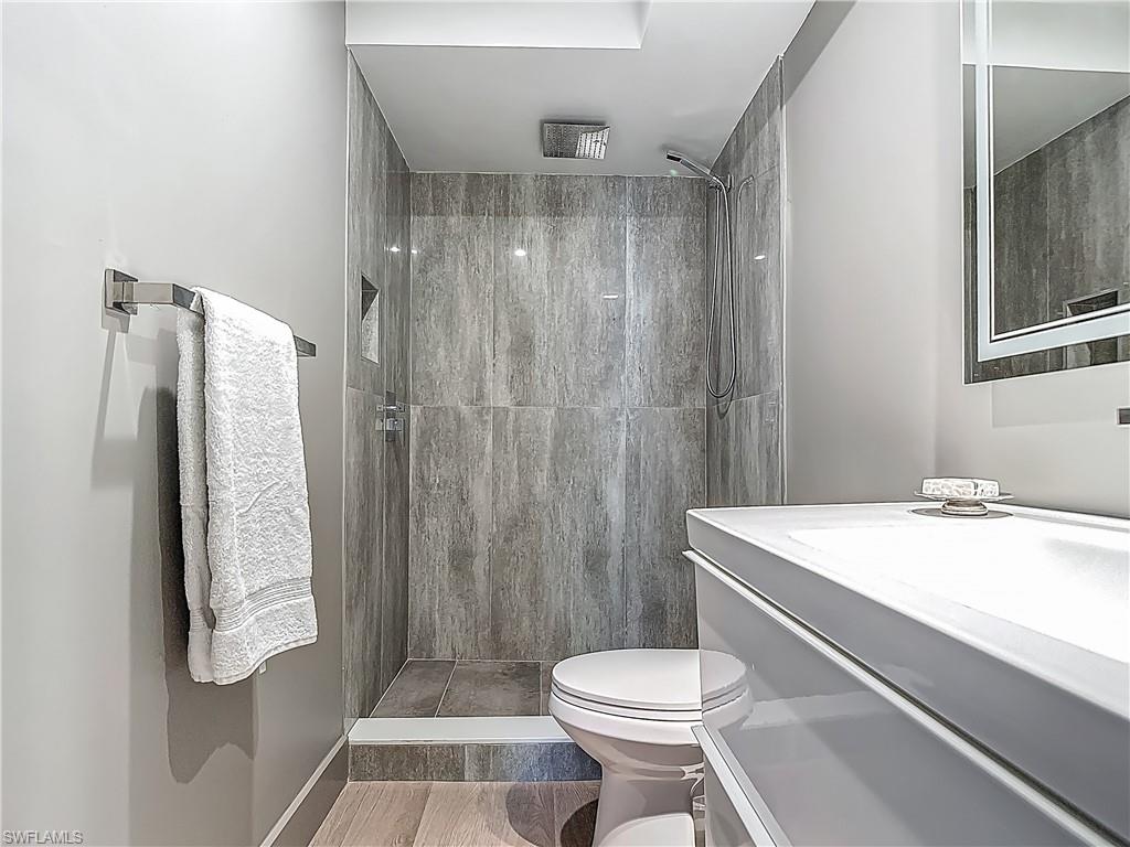 2544 First Street, Unit 102 Fort Myers, FL 33901 - Photo 20 of 26 a bathroom with a sink toilet and shower