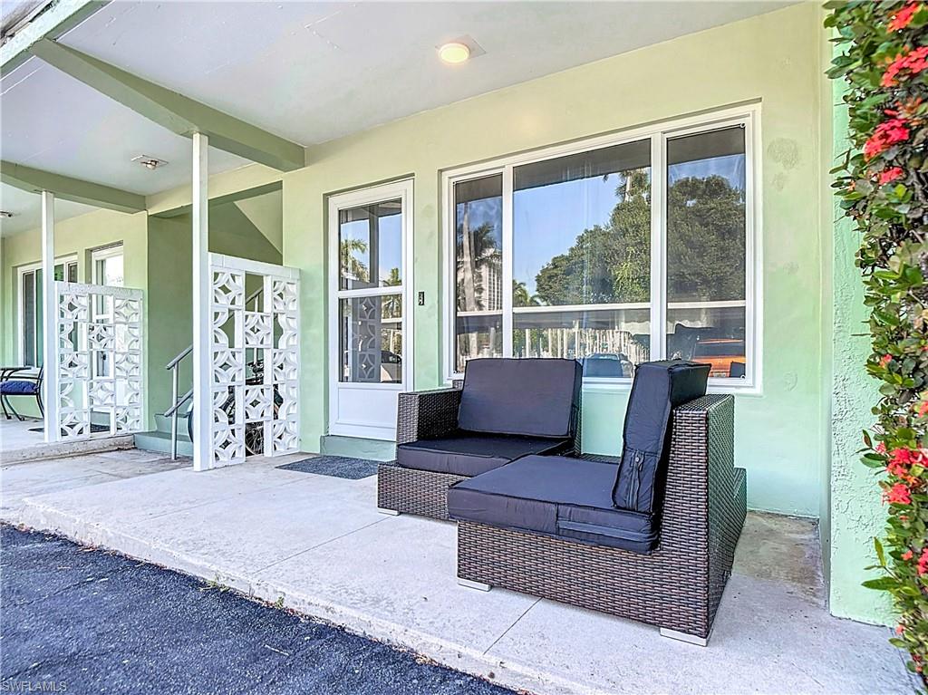 2544 First Street, Unit 102 Fort Myers, FL 33901 - Photo 4 of 26 a living room with furniture and potted plants