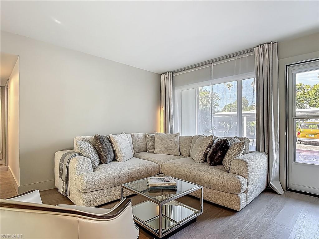 2544 First Street, Unit 102 Fort Myers, FL 33901 - Photo 6 of 26 a living room with furniture and a large window