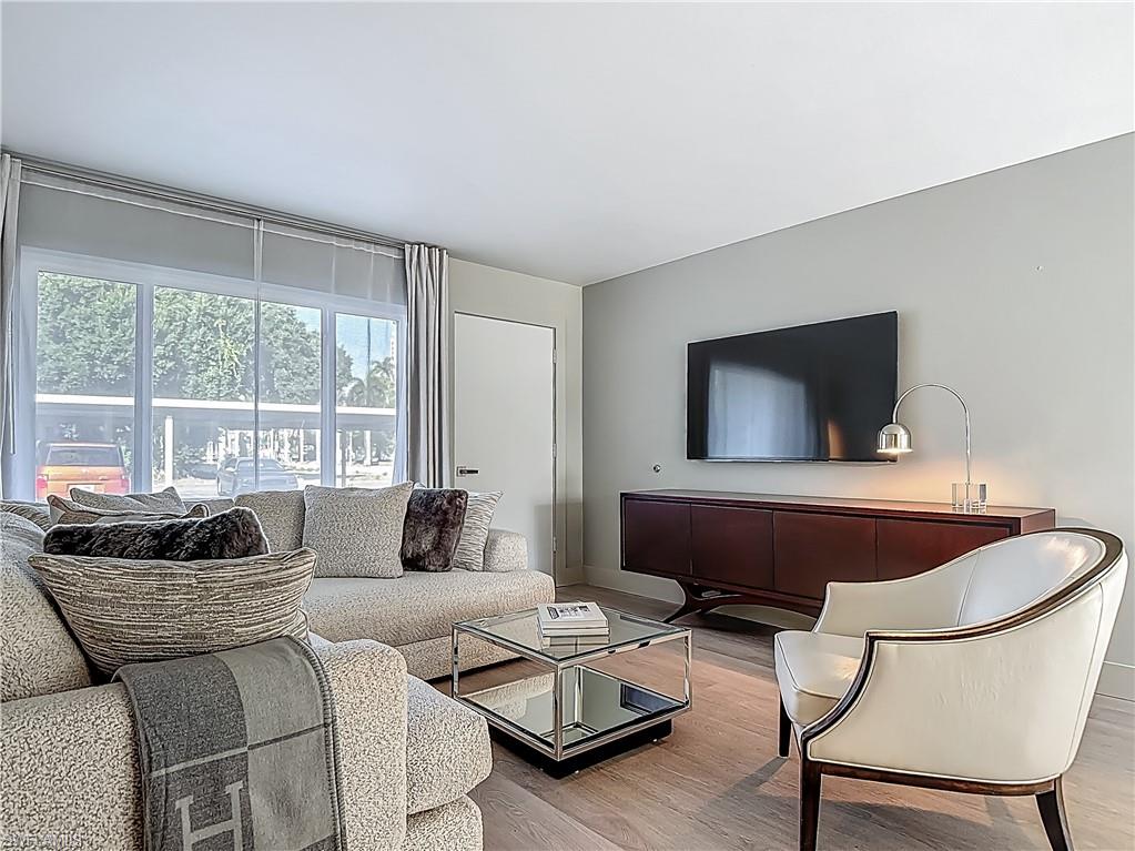 2544 First Street, Unit 102 Fort Myers, FL 33901 - Photo 7 of 26 a living room with furniture and a large window