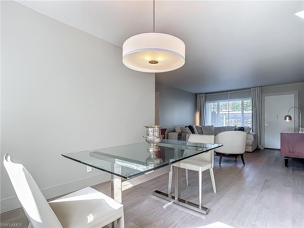 2544 First Street, Unit 102 Fort Myers, FL 33901 - Photo 10 of 26 a living room with furniture and a large window