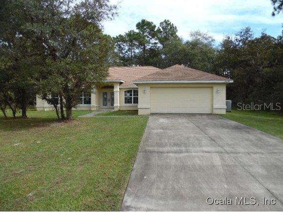 14575 Southwest 61st Court Ocala, FL 34473 - Photo 1 of 1 a front view of house with yard and green space
