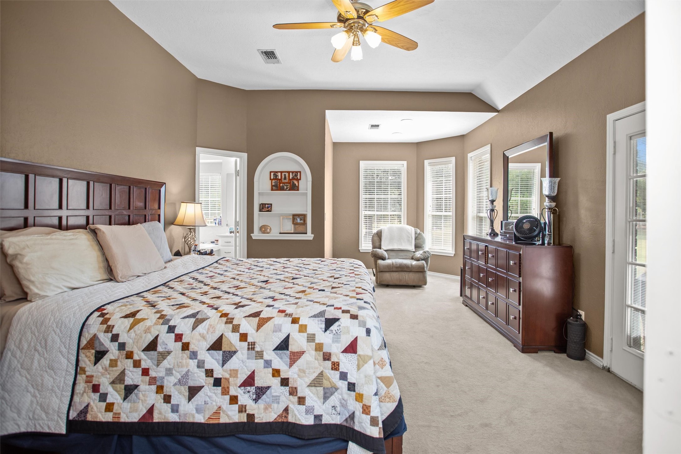 2101 San Antonio Road Crockett, TX 75835 - Photo 18 of 37 a bedroom with a large bed and a chandelier