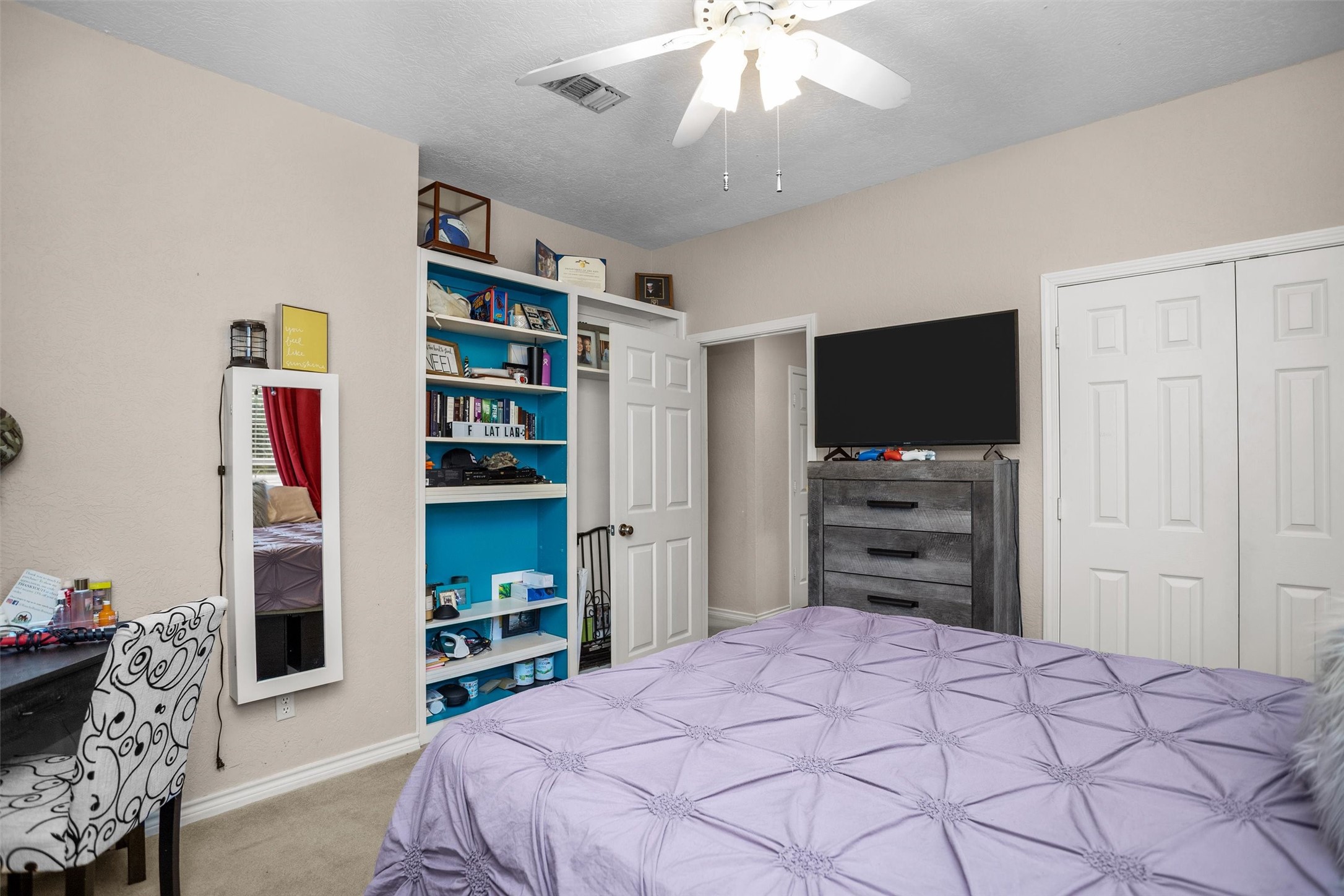 2101 San Antonio Road Crockett, TX 75835 - Photo 26 of 37 a bedroom with a bed and a flat screen tv