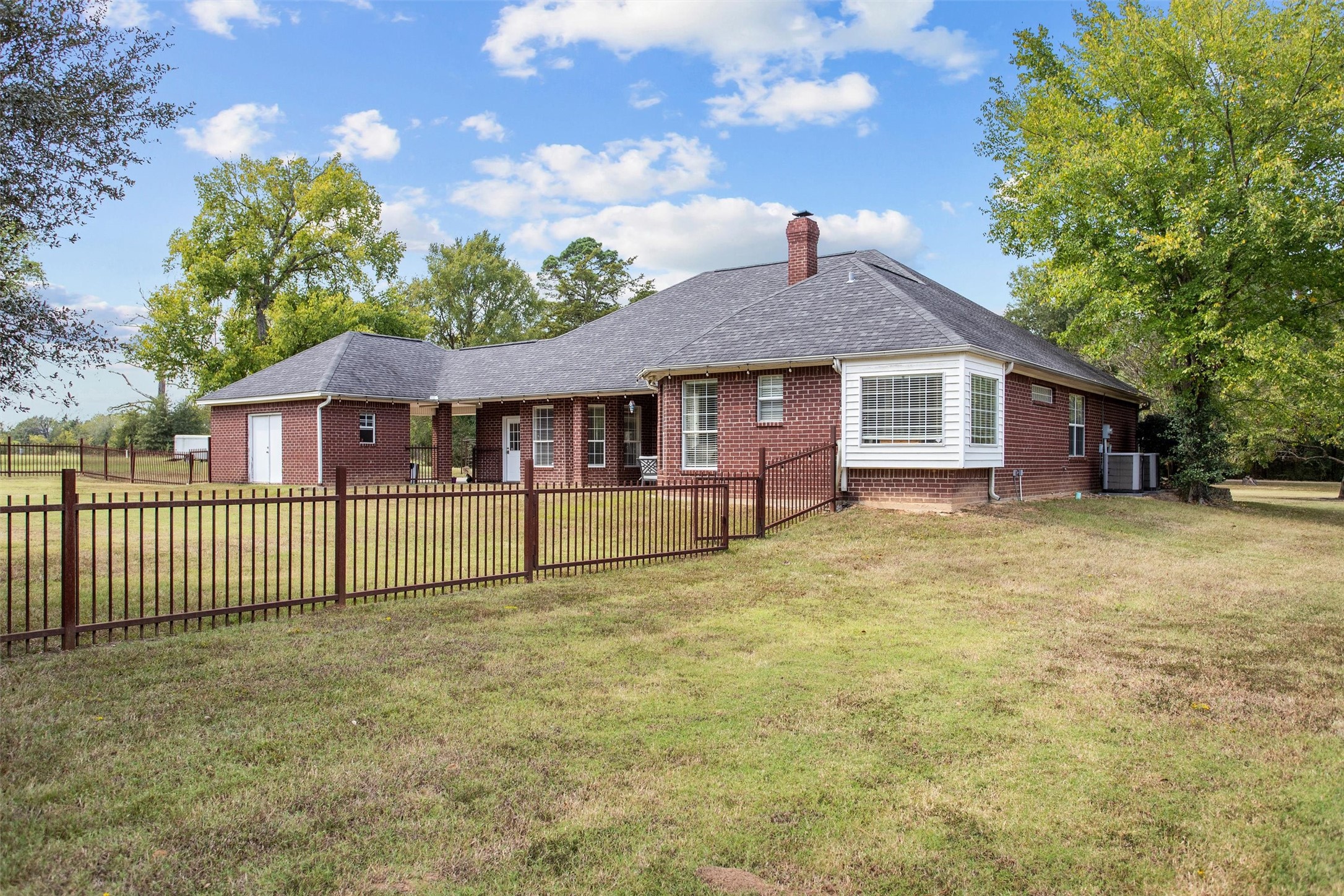 2101 San Antonio Road Crockett, TX 75835 - Photo 34 of 37 a front view of a house with a garden