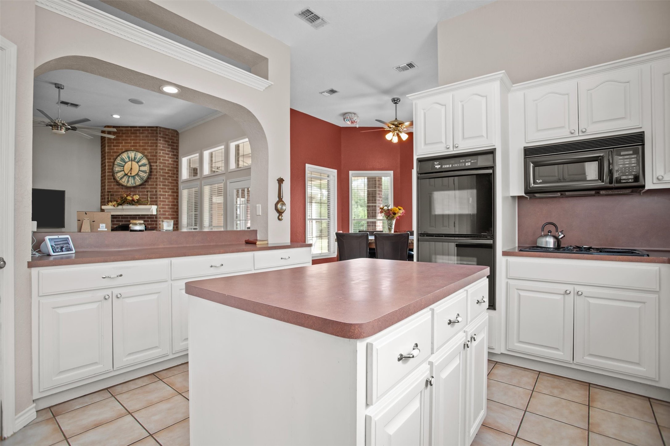 2101 San Antonio Road Crockett, TX 75835 - Photo 7 of 37 a kitchen with granite countertop a sink and white cabinets