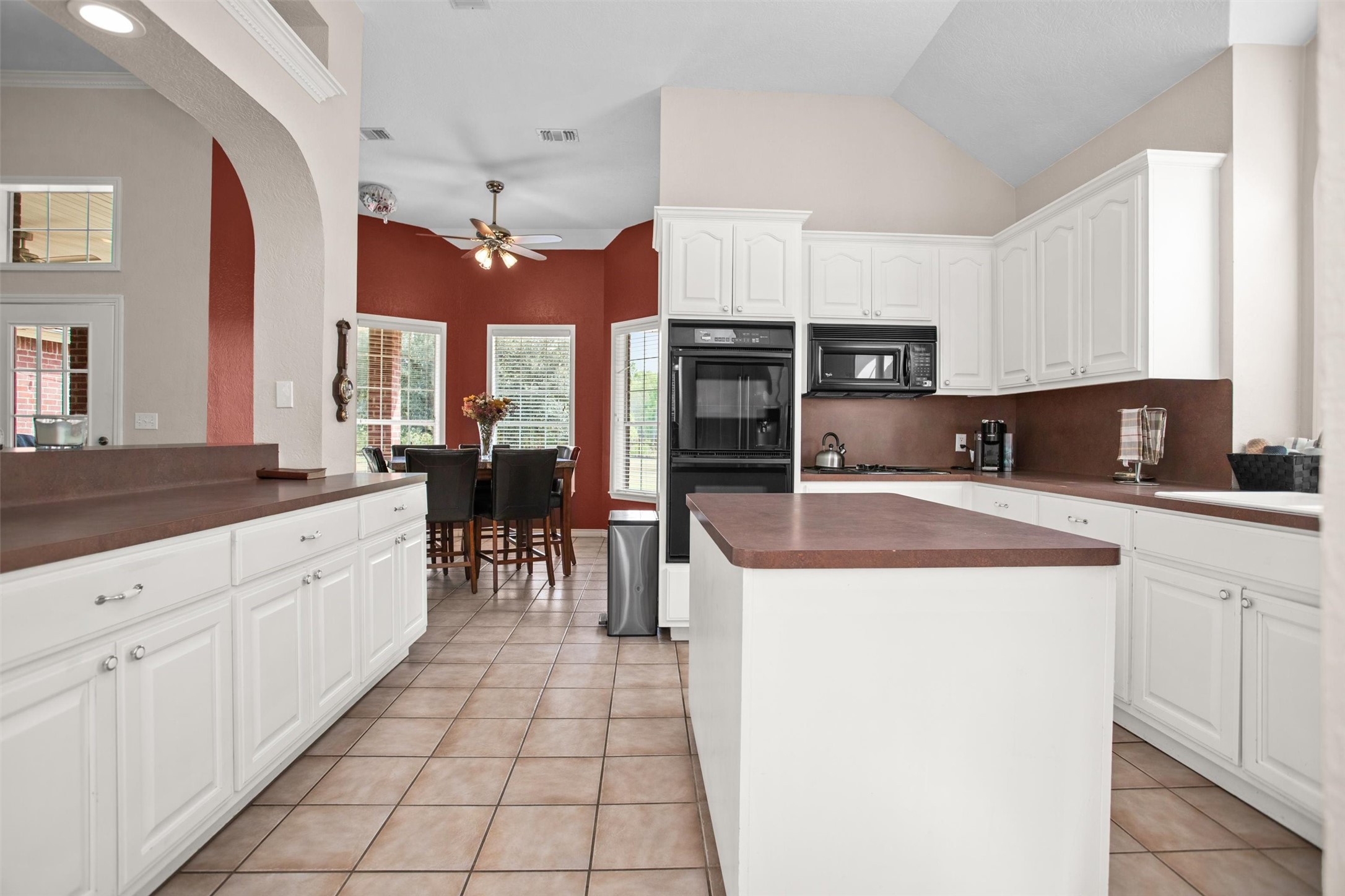 2101 San Antonio Road Crockett, TX 75835 - Photo 10 of 37 a large kitchen with stainless steel appliances granite countertop a stove a sink dishwasher and a refrigerator