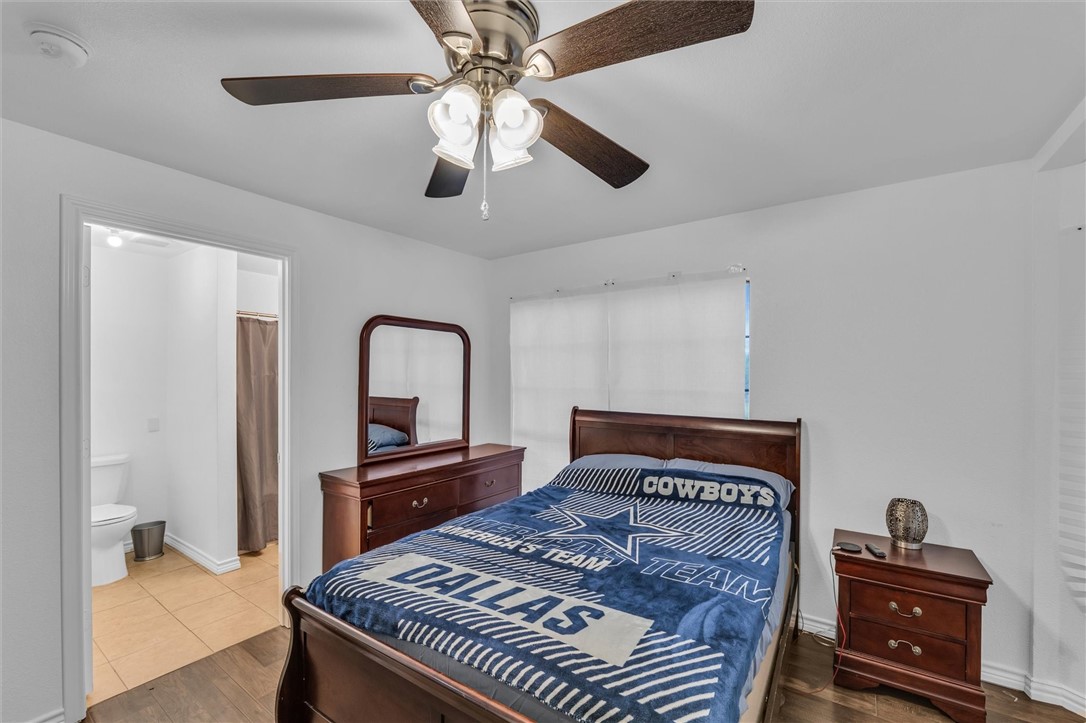 1940 East Highland Road Waxahachie, TX 75167 - Photo 11 of 44 a bedroom with a bed and a dresser