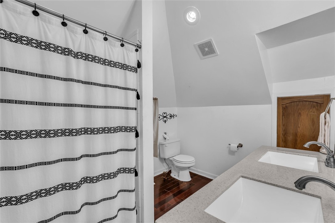 1940 East Highland Road Waxahachie, TX 75167 - Photo 28 of 44 a bathroom with a sink and a shower curtain
