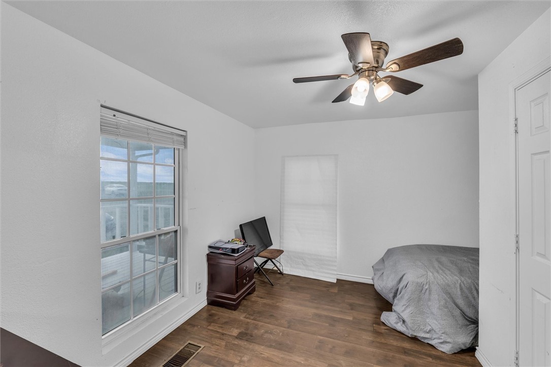 1940 East Highland Road Waxahachie, TX 75167 - Photo 39 of 44 a room with a window and wooden floor