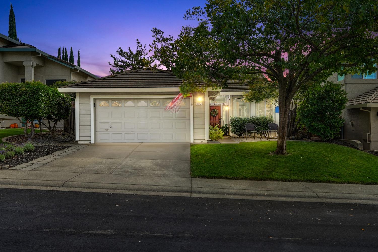 110 Whiting Way Folsom, CA 95630 - Photo 1 of 1 a front view of a house with a yard and garage