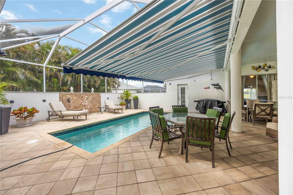 48 Bunker Road Rotonda West, FL 33947 - Photo 44 of 59 a view of a dining tables and chairs in a patio
