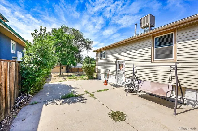a view of backyard with a patio