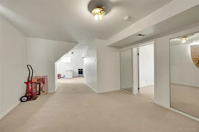 a view of a livingroom with gym equipment