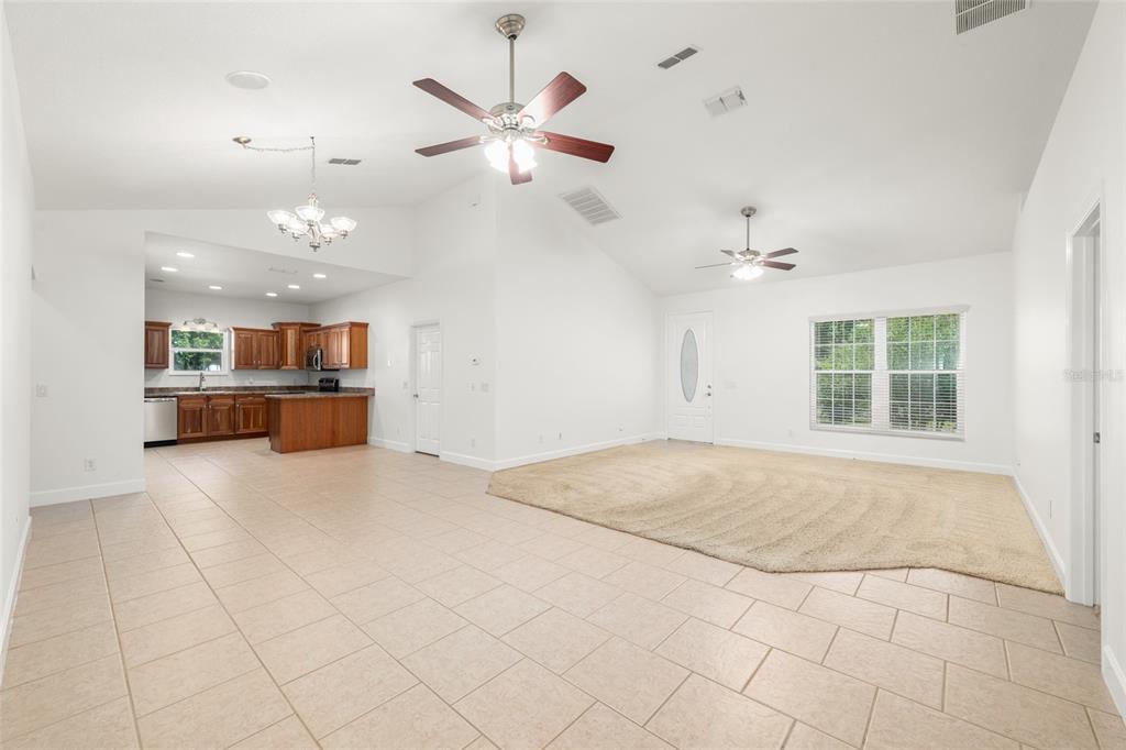 4735 Southeast 112th Street Road Belleview, FL 34420 - Photo 22 of 73 an empty room with kitchen and a window