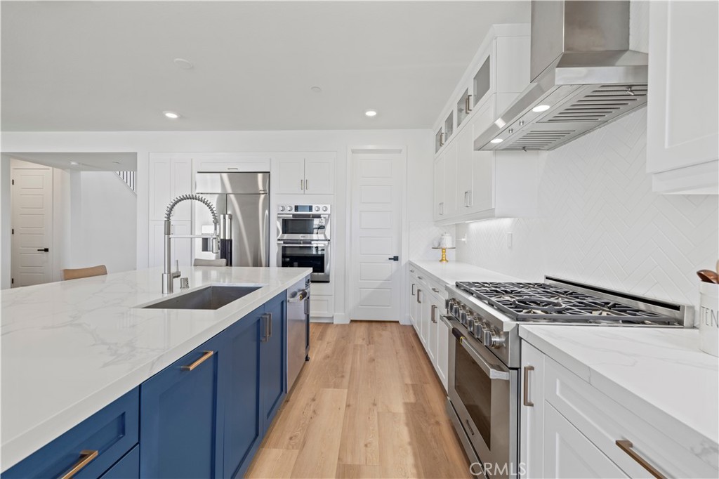 30015 Chestnut Lane Castaic, CA 91384 - Photo 14 of 60 a kitchen with stainless steel appliances granite countertop a sink stove and cabinets