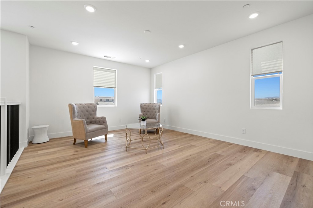 30015 Chestnut Lane Castaic, CA 91384 - Photo 25 of 60 a living room with furniture and a dining table with wooden floor