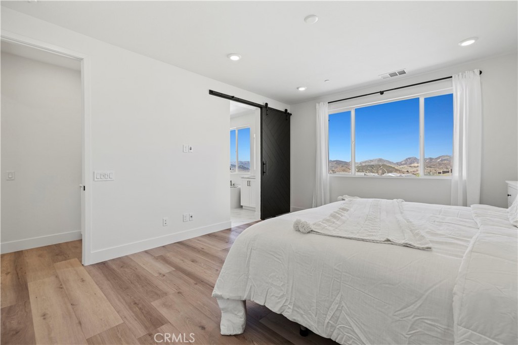 30015 Chestnut Lane Castaic, CA 91384 - Photo 27 of 60 a large white bed in a white room