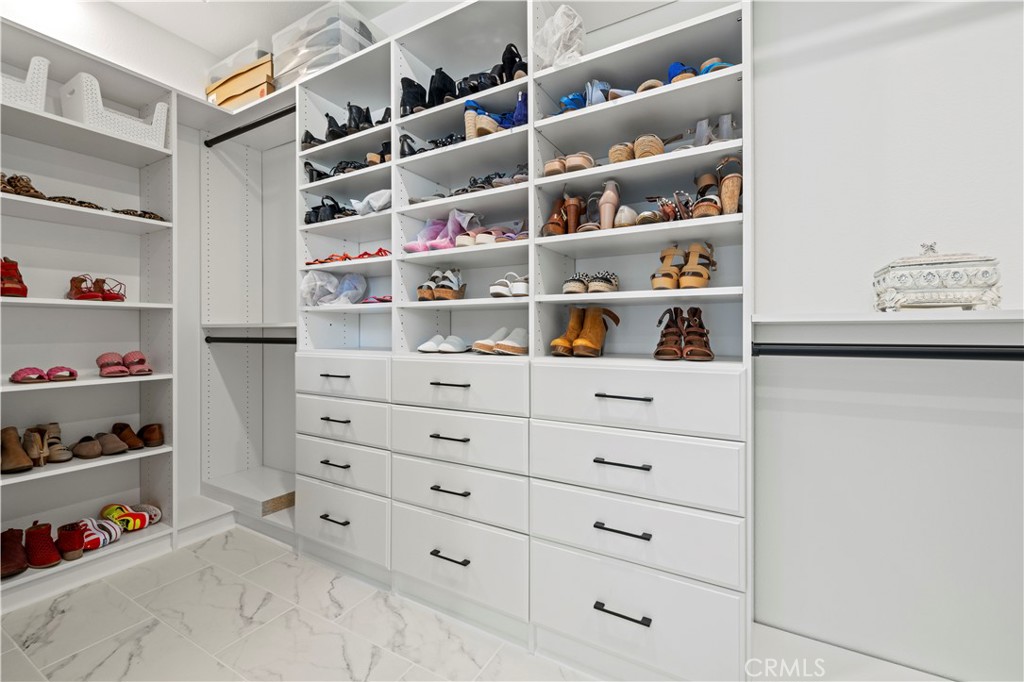 30015 Chestnut Lane Castaic, CA 91384 - Photo 30 of 60 a view of walk in closet with clothes and shoes