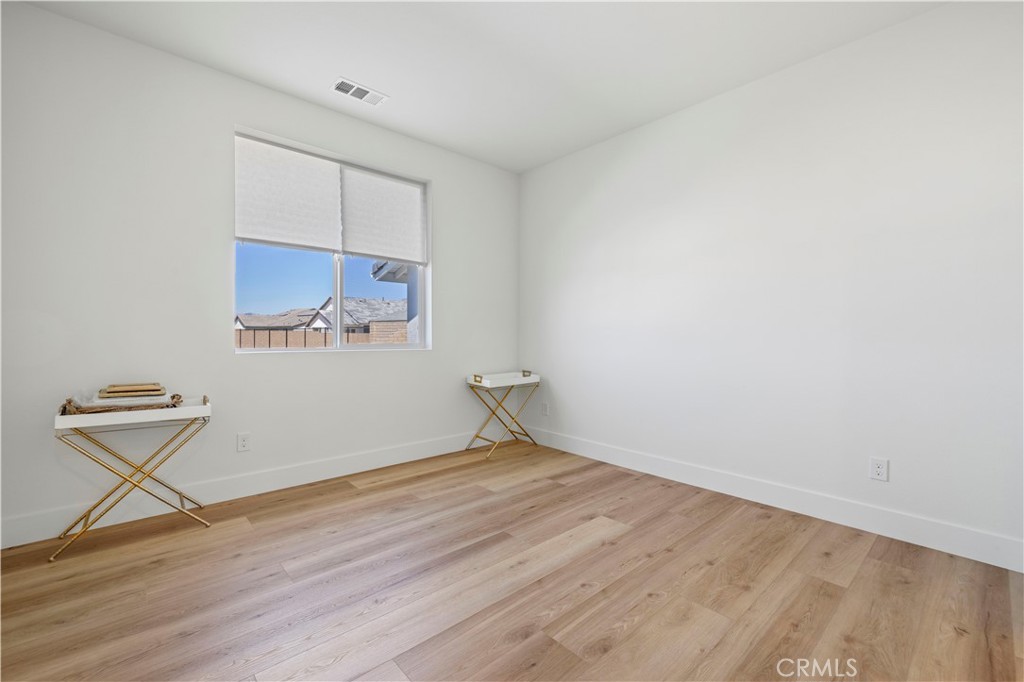 30015 Chestnut Lane Castaic, CA 91384 - Photo 32 of 60 a view of room with window and wooden floor