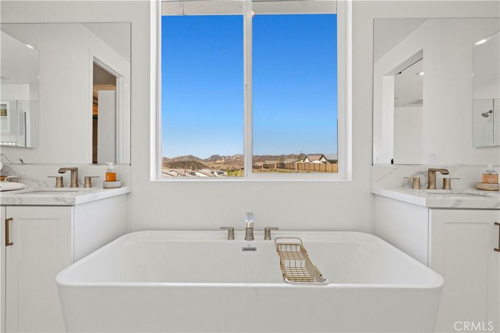 30015 Chestnut Lane Castaic, CA 91384 - Photo 40 of 60 a bathroom with a bathtub sink and window