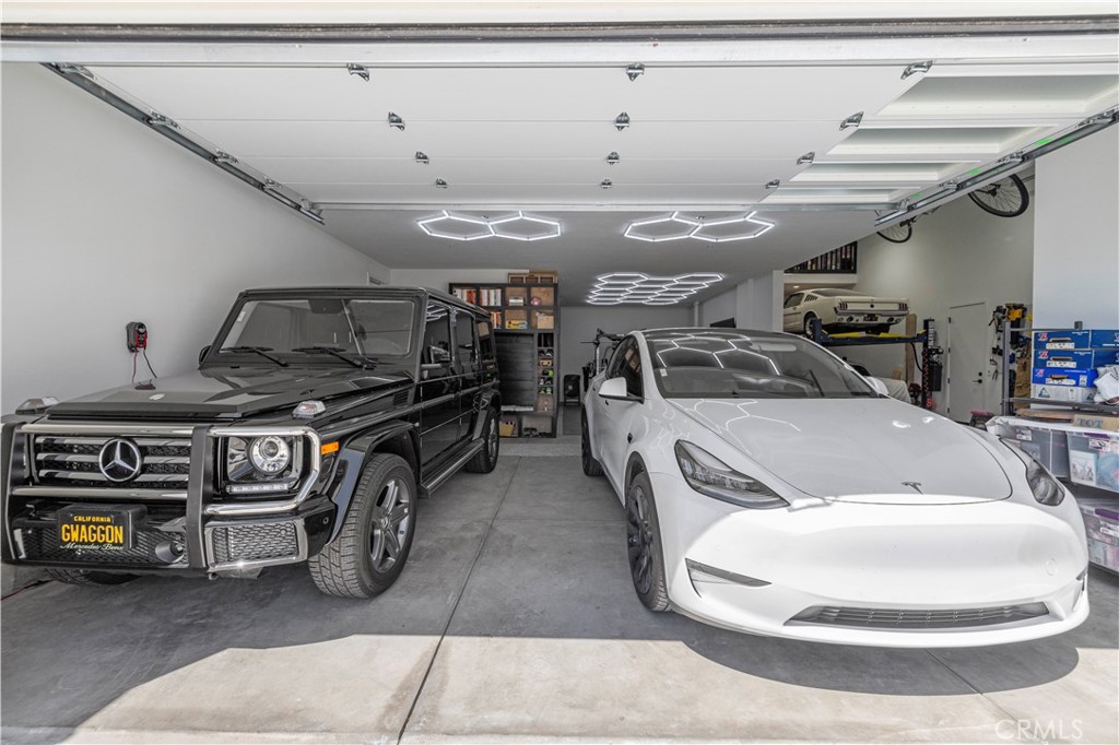 30015 Chestnut Lane Castaic, CA 91384 - Photo 55 of 60 a car and bike parked in a garage