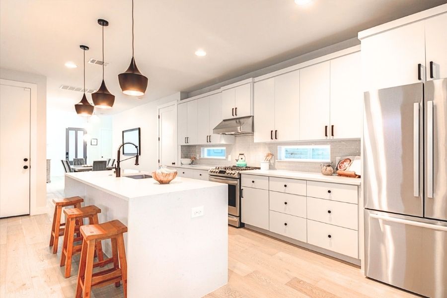 916 East 50th Street, Unit 1 Austin, TX 78751 - Photo 30 of 36 Convenient access to the clean and bright kitchen from the garage (which already has an EV charger installed). CLICK VIRTUAL TOUR FOR FLOOR PLAN AND 3D WALK THROUGH!