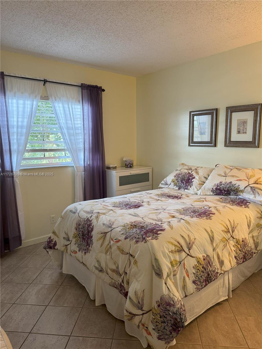 375 Southwest 56th Avenue, Unit 201 Margate, FL 33068 - Photo 9 of 39 with private bathroom and walk-in