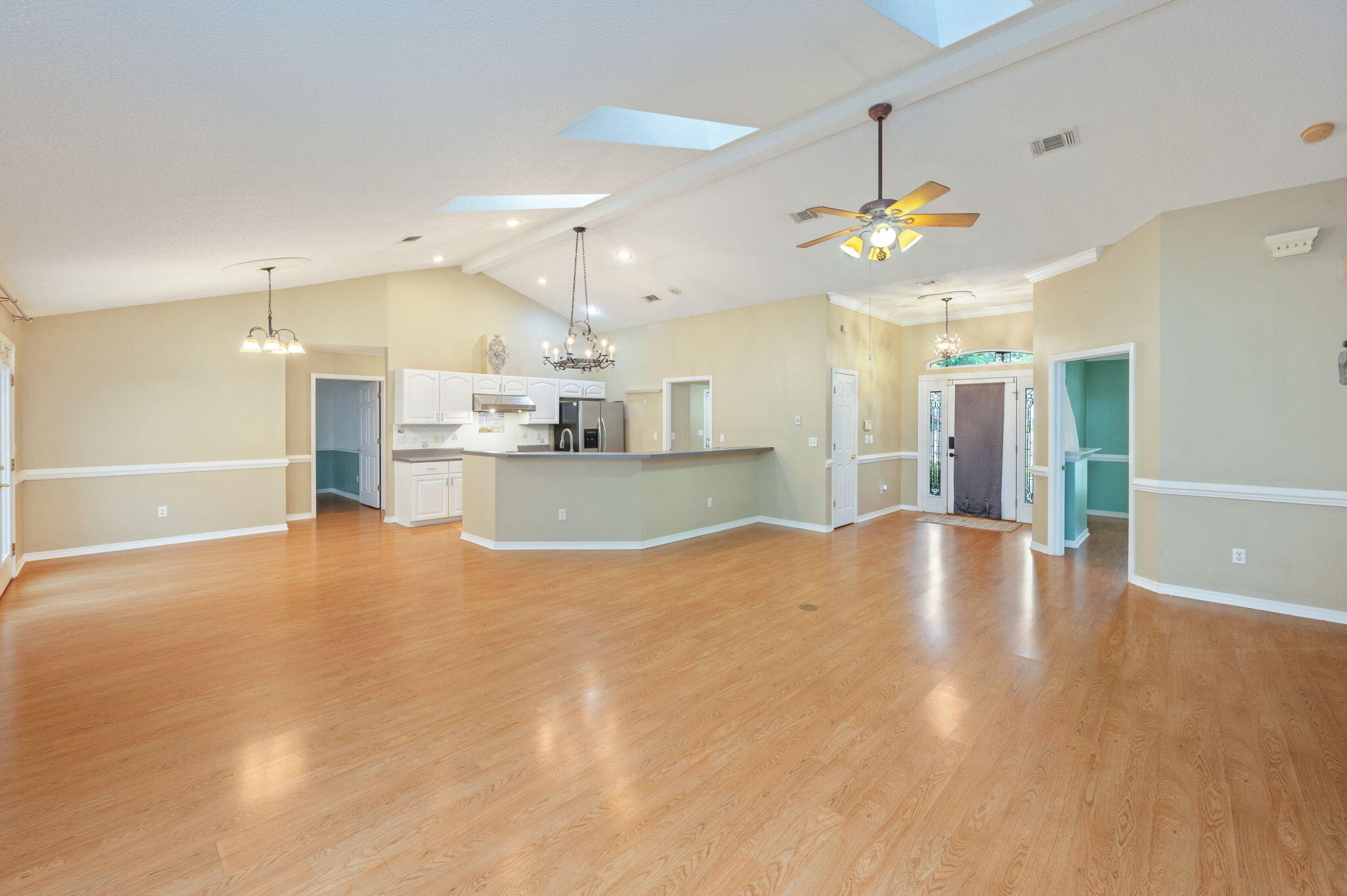 734 Riva Ridge Drive Crestview, FL 32539 - Photo 11 of 53 a view of an empty room and kitchen view