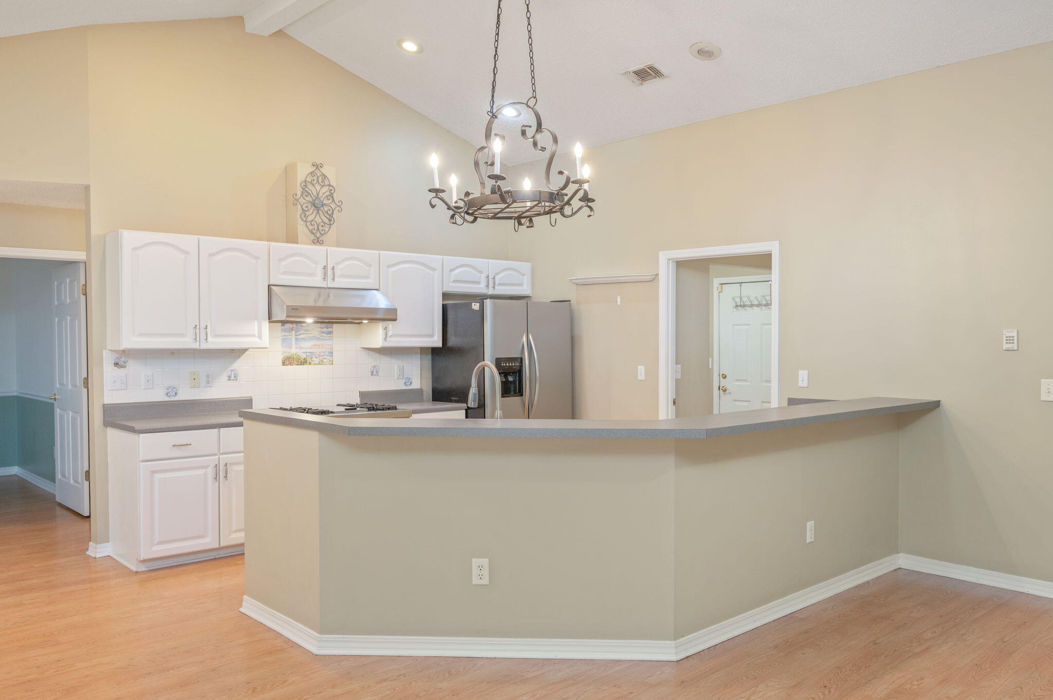 734 Riva Ridge Drive Crestview, FL 32539 - Photo 12 of 53 a view of a kitchen with stainless steel appliances granite countertop a stove a sink dishwasher and a refrigerator with wooden floor